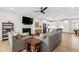 Comfortable living room featuring a fireplace, modern decor, and an open layout to the kitchen at 4412 Powell Grove Ct, Raleigh, NC 27606