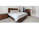 Nicely appointed main bedroom showcases a large bed with matching nightstands and dressers with closet access at 4412 Powell Grove Ct, Raleigh, NC 27606