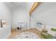Attic playroom with a wooden beam, toy storage and a play rug at 4412 Powell Grove Ct, Raleigh, NC 27606