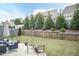 Picturesque backyard with mature trees, retaining wall, and outdoor seating, perfect for relaxation at 45 Davelyn Ct, Garner, NC 27529