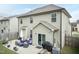 A backyard with a patio featuring outdoor seating, an umbrella, and a grill, ideal for outdoor living at 45 Davelyn Ct, Garner, NC 27529