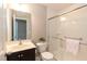 Well-lit bathroom featuring a vanity with modern fixtures and a glass-enclosed shower at 45 Davelyn Ct, Garner, NC 27529