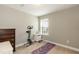 Spare bedroom with natural light, featuring workout equipment and a neutral color scheme at 45 Davelyn Ct, Garner, NC 27529
