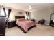 Comfortable bedroom featuring a ceiling fan, and a soft pink bedspread, with bedside tables at 45 Davelyn Ct, Garner, NC 27529