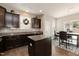 Inviting dining area with dark wood cabinets, a chandelier, and natural light from a window at 45 Davelyn Ct, Garner, NC 27529