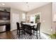 Cozy dining area featuring a modern chandelier and sliding glass doors that lead to the yard at 45 Davelyn Ct, Garner, NC 27529