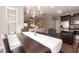 Inviting dining area features modern chandelier, stainless steel appliances, and seamless flow into the living room at 45 Davelyn Ct, Garner, NC 27529