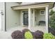 Inviting front porch with decorative columns and bench seating, framed by colorful landscaping at 45 Davelyn Ct, Garner, NC 27529