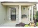 Cozy covered front porch with a decorative wreath and a 'Welcome Home' doormat at 45 Davelyn Ct, Garner, NC 27529