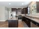 Modern kitchen featuring stainless steel appliances, dark cabinets, and a functional center island at 45 Davelyn Ct, Garner, NC 27529