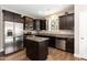 Contemporary kitchen with stainless appliances, dark cabinetry, and granite countertops at 45 Davelyn Ct, Garner, NC 27529