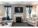 Inviting living room features a cozy fireplace, plush seating, and abundant natural light at 45 Davelyn Ct, Garner, NC 27529