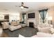 Bright living room with fireplace, comfortable seating, and a ceiling fan for added comfort at 45 Davelyn Ct, Garner, NC 27529