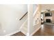 Carpeted staircase with a wooden handrail leads to the upper level at 45 Davelyn Ct, Garner, NC 27529