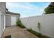 Backyard of home featuring a white privacy fence, concrete patio, and storage shed at 5000 Avenida Del Sol Dr, Raleigh, NC 27616