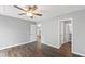 Spacious bedroom with neutral walls, wood-look floors, and a ceiling fan, offering comfort and style at 5000 Avenida Del Sol Dr, Raleigh, NC 27616