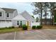 Charming townhome featuring a bright yellow door and a well-maintained, fenced front yard at 5000 Avenida Del Sol Dr, Raleigh, NC 27616