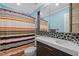Charming bathroom with double sink vanity, mosaic tile backsplash, decorative shower curtain and updated fixtures at 504 Cameron Glen Dr, Apex, NC 27502