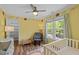 Bright Bedroom features wood floors, a ceiling fan, neutral toned walls with charming animal decals, and natural light at 504 Cameron Glen Dr, Apex, NC 27502