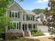 Charming home with a welcoming front porch, well-manicured landscaping, and a two-car garage at 504 Cameron Glen Dr, Apex, NC 27502