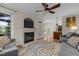 Open-concept living room featuring a fireplace, access to the outdoors, and views of the kitchen at 504 Cameron Glen Dr, Apex, NC 27502