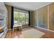 Cozy playroom with natural light, hardwood floors, playful wall decor and views of backyard at 504 Cameron Glen Dr, Apex, NC 27502