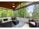 Relaxing screened porch with ceiling fans and comfortable seating, offering views of the outdoors at 504 Cameron Glen Dr, Apex, NC 27502