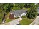 Aerial view of a single-story home showing the well-maintained lawn, driveway, and surrounding greenery at 508 2Nd Street St, Apex, NC 27502