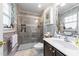 Bathroom featuring large shower, tiled walls, and spacious vanity with mirror at 508 2Nd Street St, Apex, NC 27502