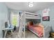 Charming bedroom with bunk bed, bright windows, and study area with desk at 508 2Nd Street St, Apex, NC 27502