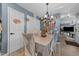 Dining room with a chandelier, modern chairs, and white doors at 508 2Nd Street St, Apex, NC 27502