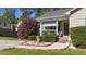 Charming single-story home featuring a covered front porch and well-maintained landscaping with decorative yard art at 508 2Nd Street St, Apex, NC 27502