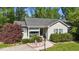 Charming single-story home featuring a cozy front porch and well-maintained landscaping with shrubs and a decorative yard at 508 2Nd Street St, Apex, NC 27502