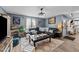 Inviting living room features a black leather sofa, fireplace, and stylish decor at 508 2Nd Street St, Apex, NC 27502