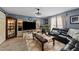 Cozy living room boasts a fireplace, modern shelving, and a large television at 508 2Nd Street St, Apex, NC 27502