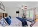 Spacious main bedroom with ceiling fan, carpeted floors, and adjacent treadmill at 508 2Nd Street St, Apex, NC 27502