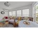 Inviting sunroom with cozy seating and abundant natural light from multiple windows at 508 2Nd Street St, Apex, NC 27502