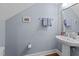 Bathroom features a pedestal sink, updated fixtures, and a clean, neutral color palette at 511 N Person St # 101, Raleigh, NC 27604