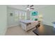 Cozy bedroom with a ceiling fan, large window and desk for an office at 511 N Person St # 101, Raleigh, NC 27604