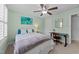 Cozy bedroom with a ceiling fan, large window and desk for an office at 511 N Person St # 101, Raleigh, NC 27604