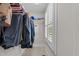 This is an organized walk-in closet with plentiful natural light at 511 N Person St # 101, Raleigh, NC 27604