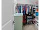 Walk-in closet with colorful clothes and storage at 511 N Person St # 101, Raleigh, NC 27604
