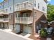 Townhouse featuring brick facade, private balconies and single car garages at 511 N Person St # 101, Raleigh, NC 27604