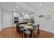 Modern kitchen with white cabinetry, stainless steel appliances, and an island with a dark countertop at 511 N Person St # 101, Raleigh, NC 27604