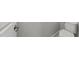 Toilet and baseboard in bathroom at 511 N Person St # 101, Raleigh, NC 27604