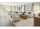 Bright and airy living room with comfortable seating, stylish decor, and ample natural light at 533 Freedom Trail Dr, Willow Springs, NC 27592