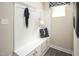 Mudroom with built-in bench, storage cabinets, coat hooks, and a window at 533 Freedom Trail Dr, Willow Springs, NC 27592