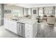 Open floor plan showcasing the kitchen island, dining area, and living room, ideal for gatherings at 533 Freedom Trail Dr, Willow Springs, NC 27592