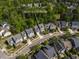 Aerial view of property in Cary featuring mature landscaping, a two car garage and close proximity to neighbors at 5605 Cary Glen Blvd, Cary, NC 27519