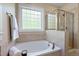 Bright bathroom showing a soaking tub and glass enclosed shower at 5605 Cary Glen Blvd, Cary, NC 27519